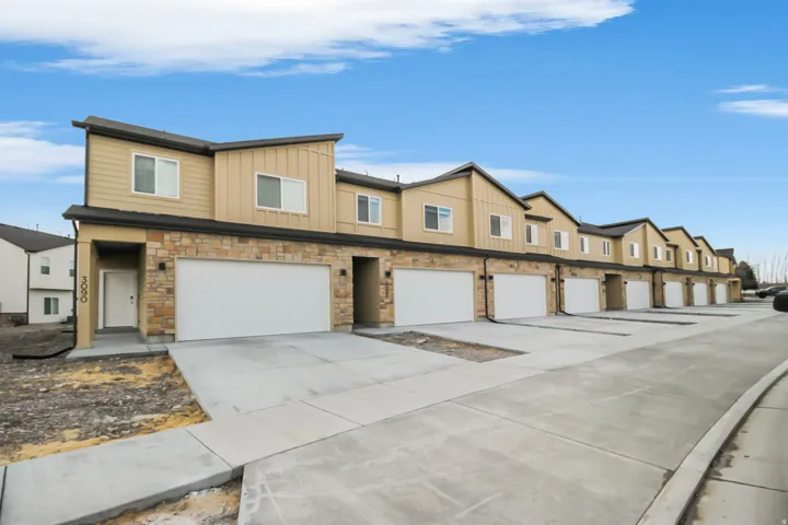Modern townhome exterior featuring contemporary siding and stone accents