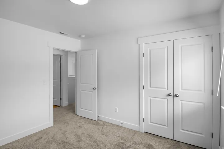 Neutral color palette with light gray carpeting