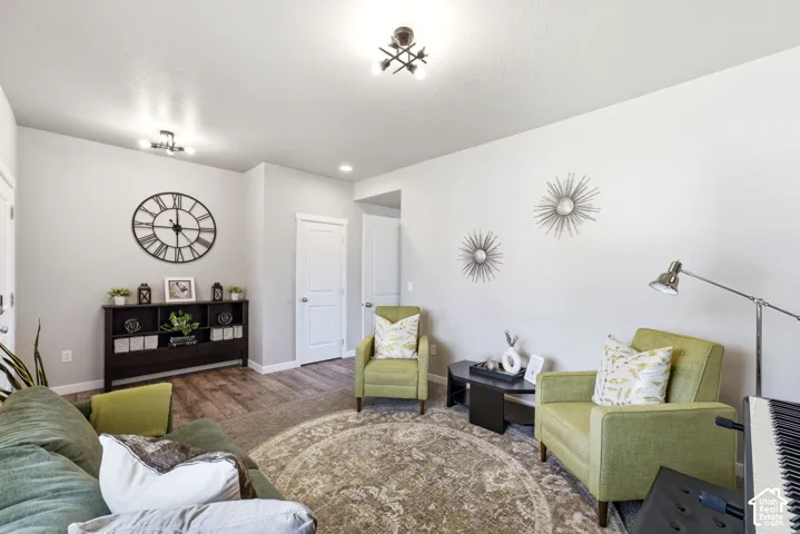 Wood-finish flooring, recessed lighting, and white trim accents