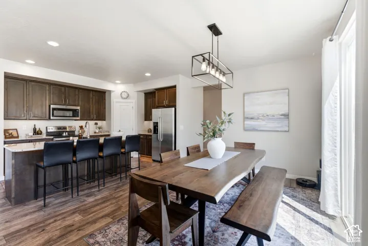Open-concept living space with wood-finish flooring