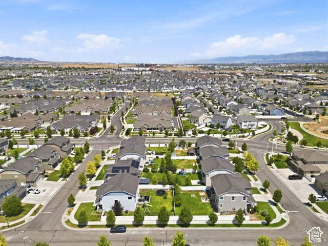 Expansive residential development with numerous single-family homes, mature landscaping, and paved streets