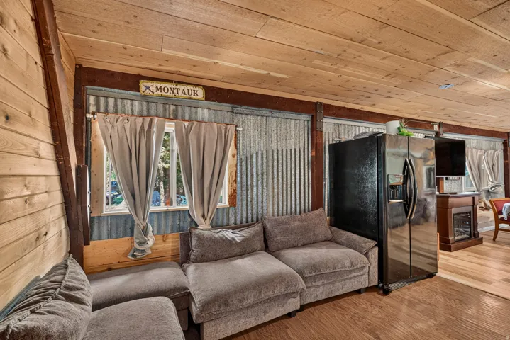 Interior space featuring wood-finish flooring and a wood-paneled ceiling