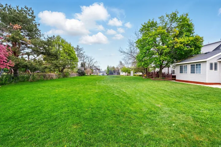 Expansive green lawn providing ample outdoor space