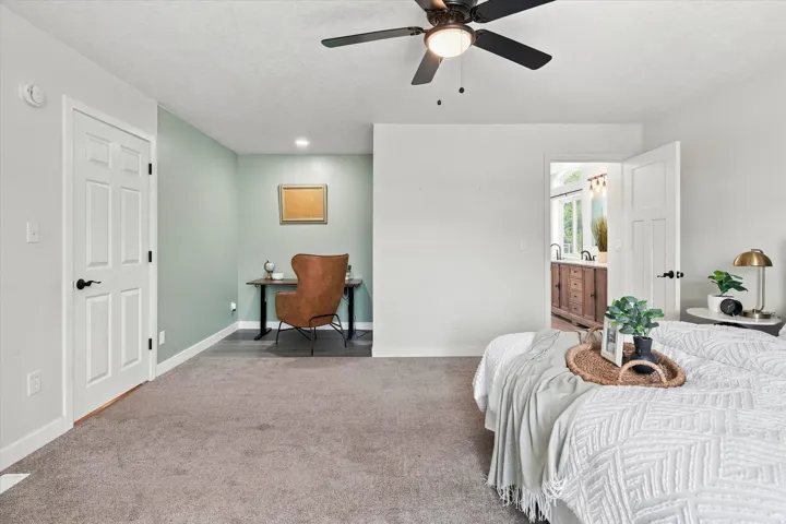 Spacious room with gray carpet and white walls