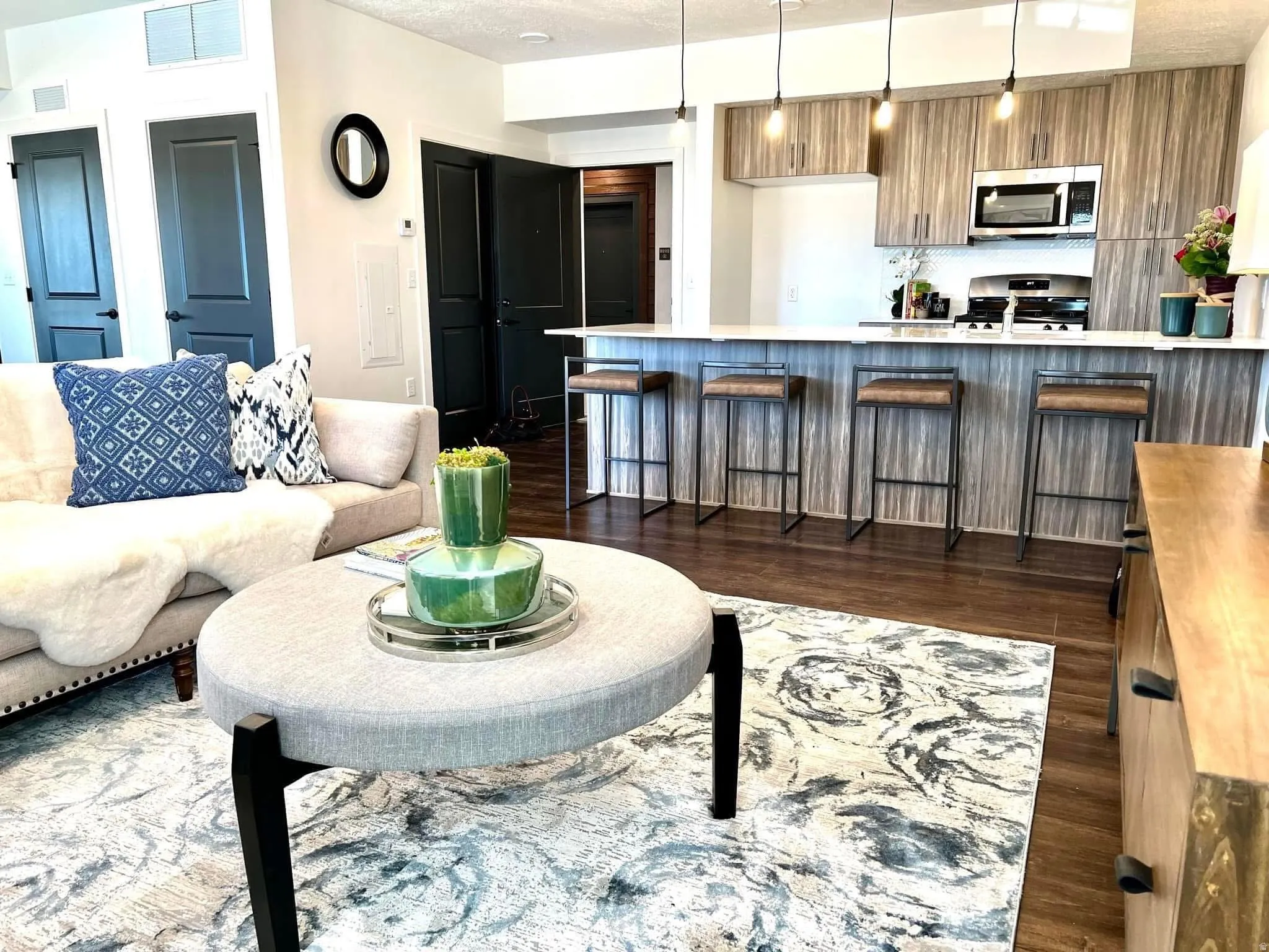 Open-concept living area featuring wood-finish flooring throughout