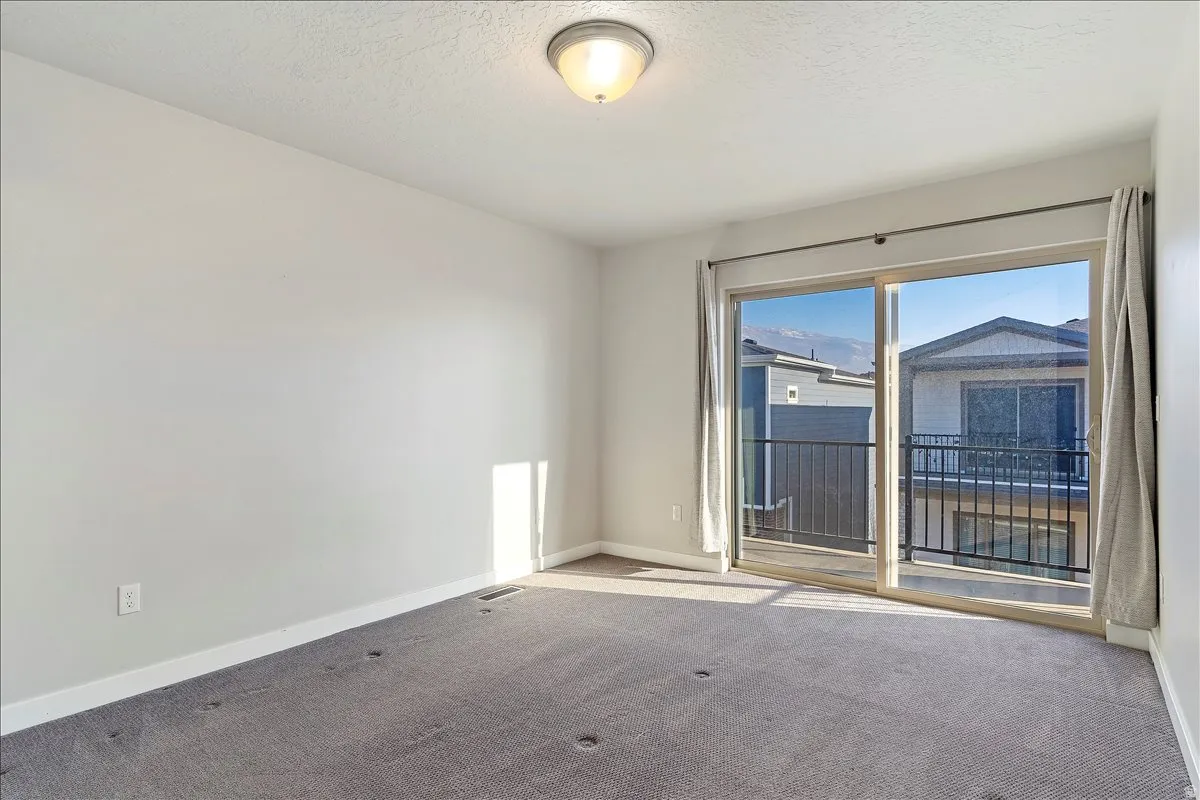PRIMARY BR and SLIDING GLASS DOORS TO COVERED DECK