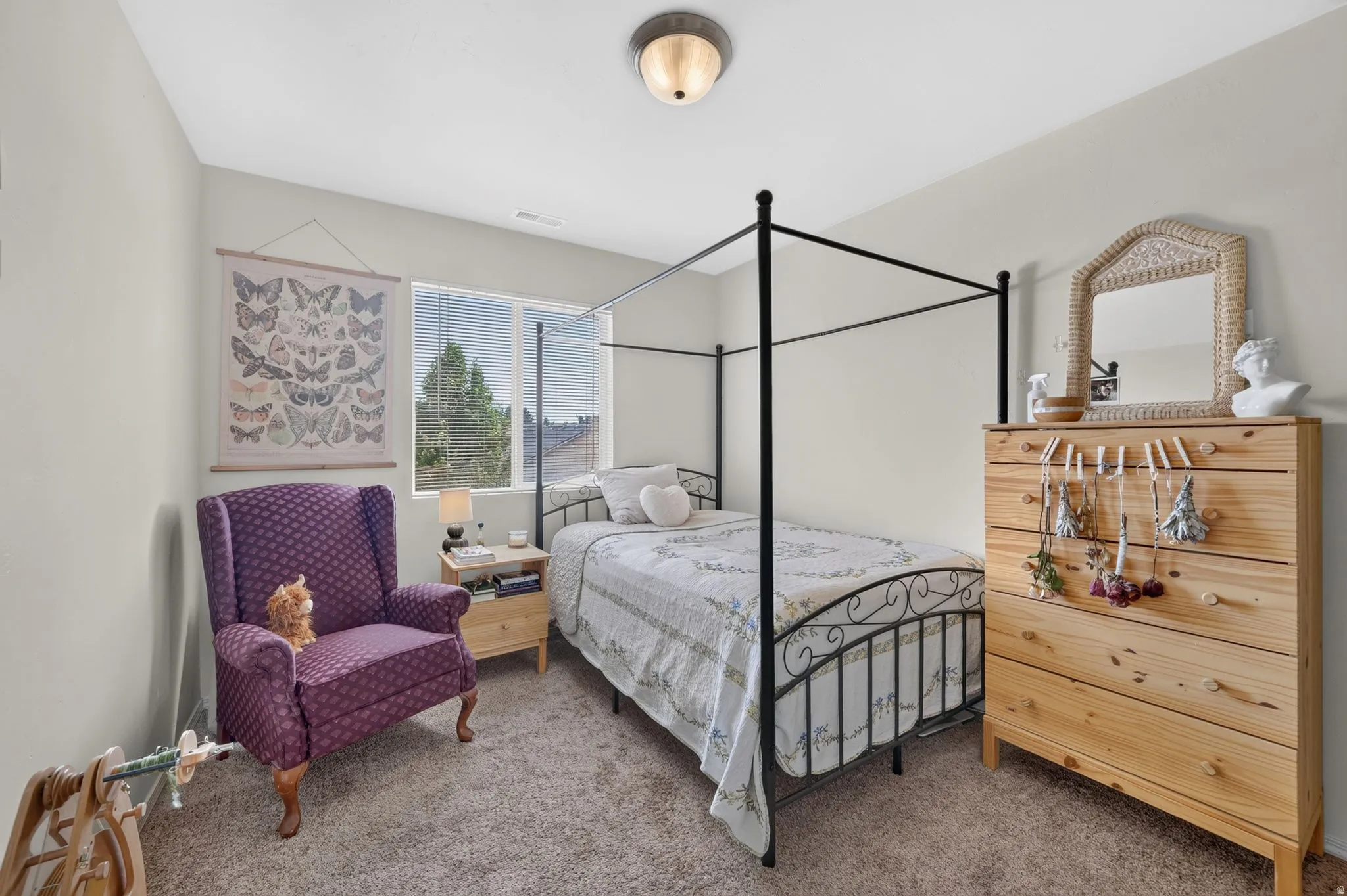 Carpeted room featuring a double window with horizontal blinds, light-toned walls, and a flush mount ceiling fixture