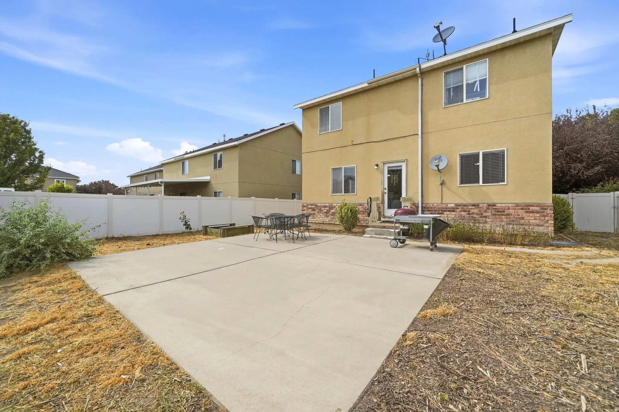 Expansive concrete patio area with direct access to the home