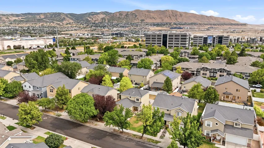 Residential neighborhood featuring a variety of single-family homes with mature trees and paved streets
