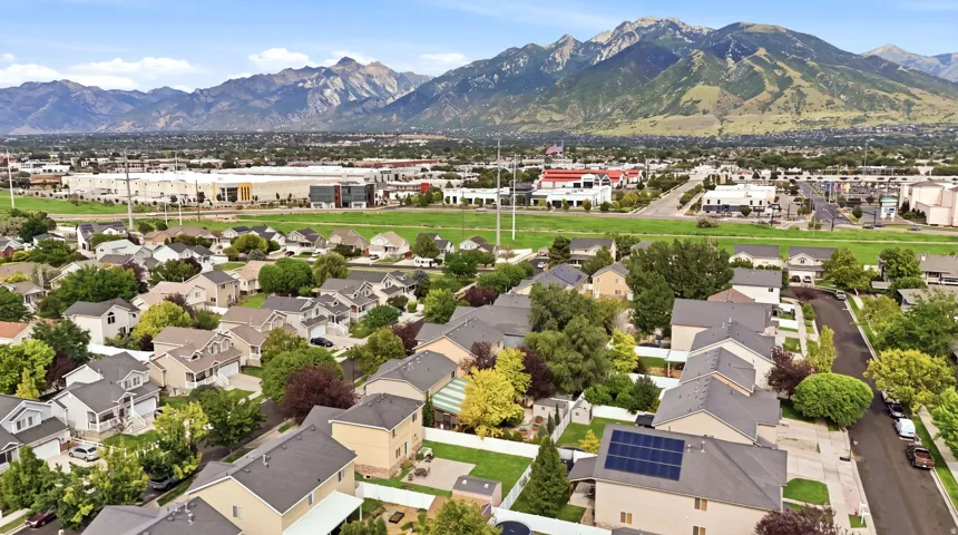 Aerial perspective showcasing a residential area with varied housing styles and mature landscaping