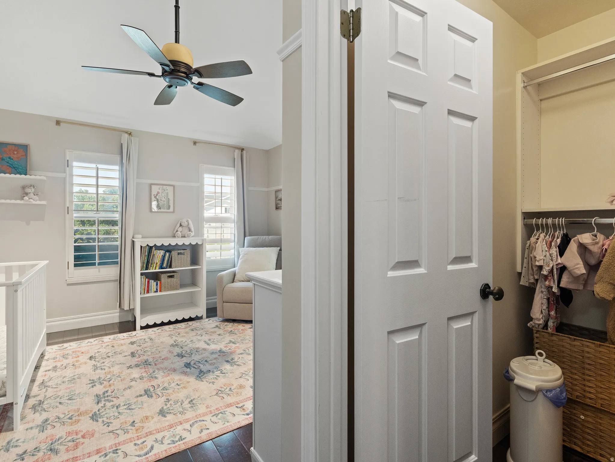 Interior room featuring dark wood-finish flooring and light wall tones
