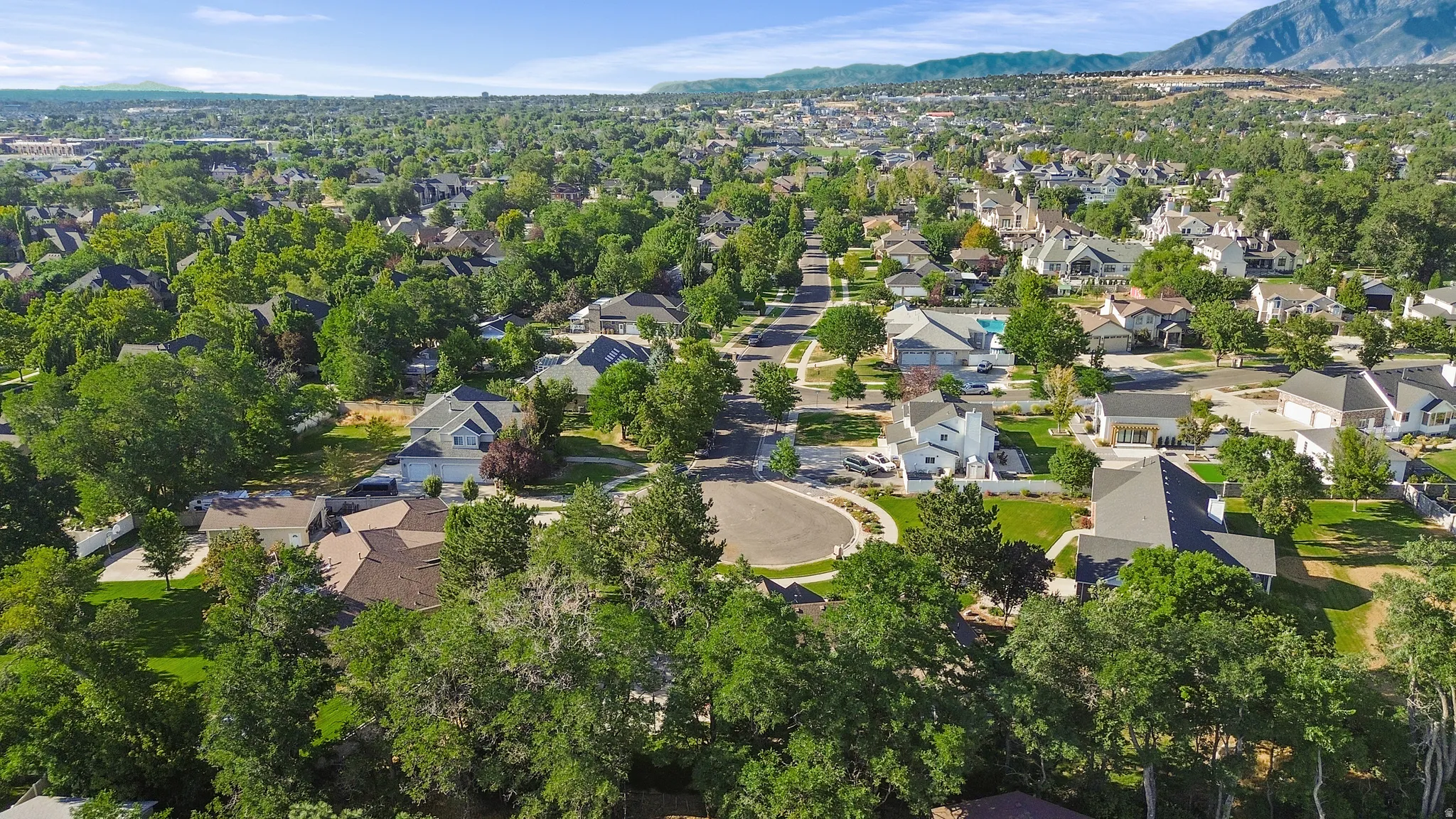 Residential neighborhood featuring mature trees and a cul-de-sac