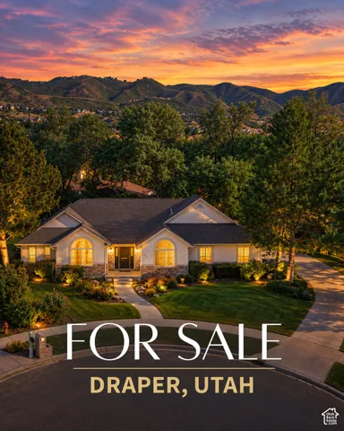 Stucco and stone exterior, arched windows, landscaped front yard with pathway, mature trees, mountain scenery