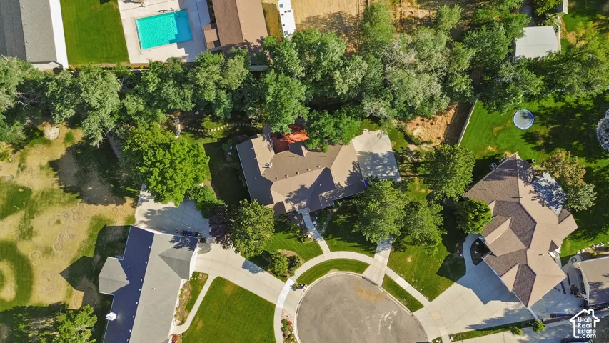 Expansive property featuring mature trees and a manicured lawn
