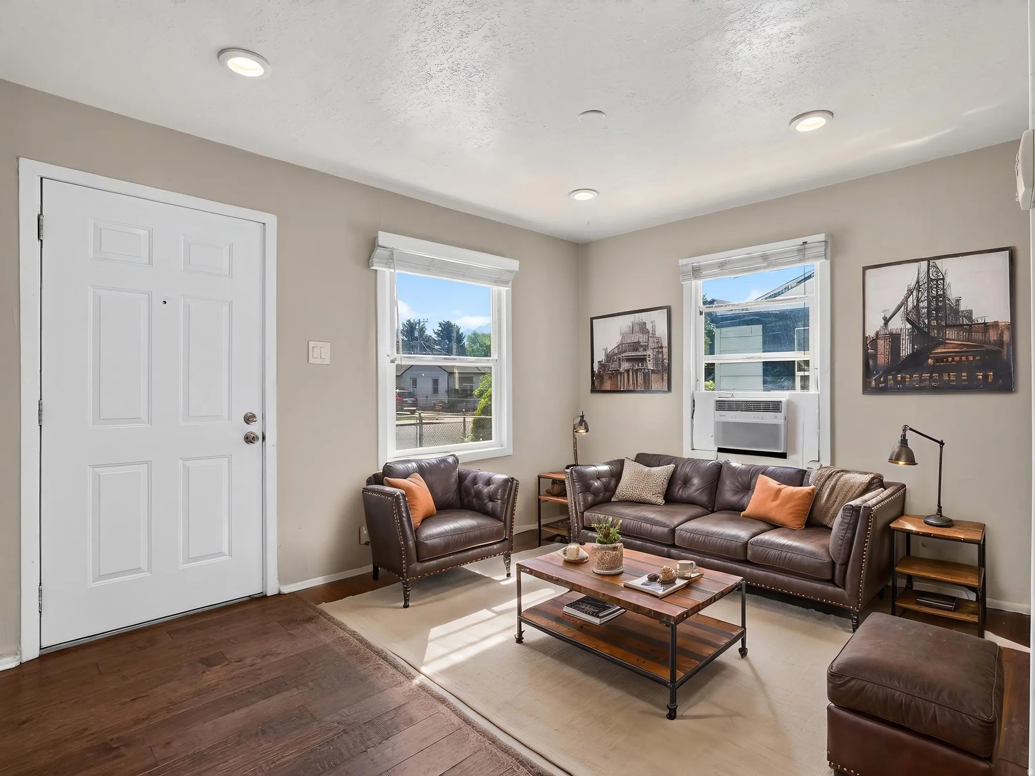 Living area featuring recessed lighting, dark wood-finish flooring, and white trim