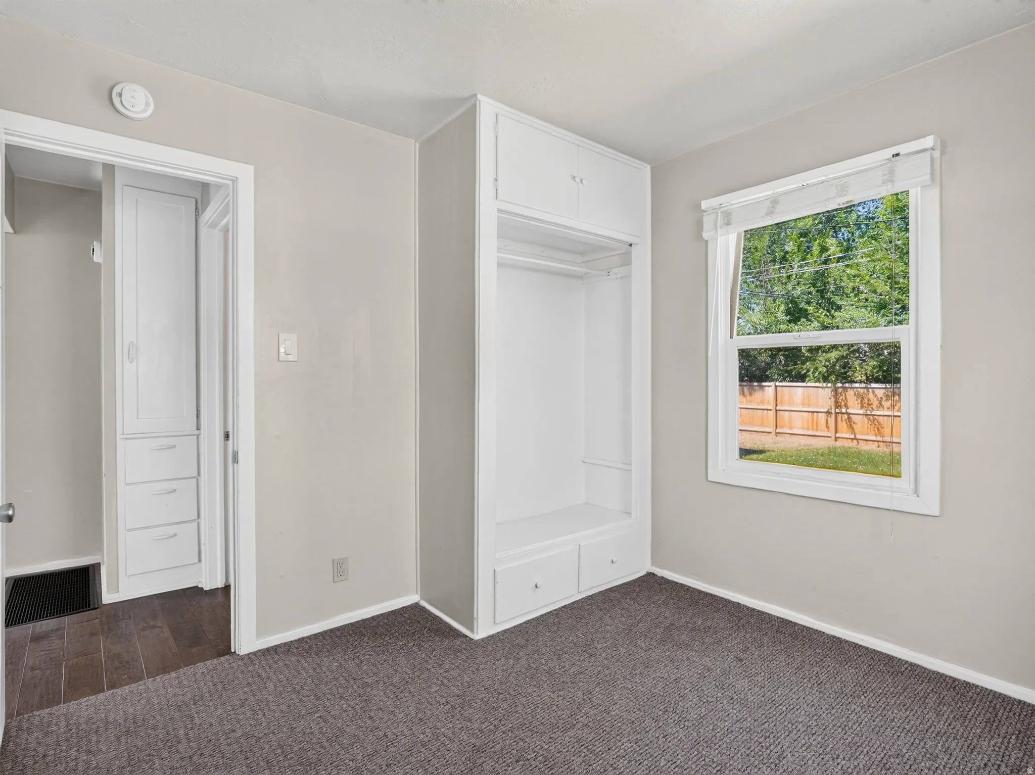Built-in wardrobe with hanging space and storage drawers