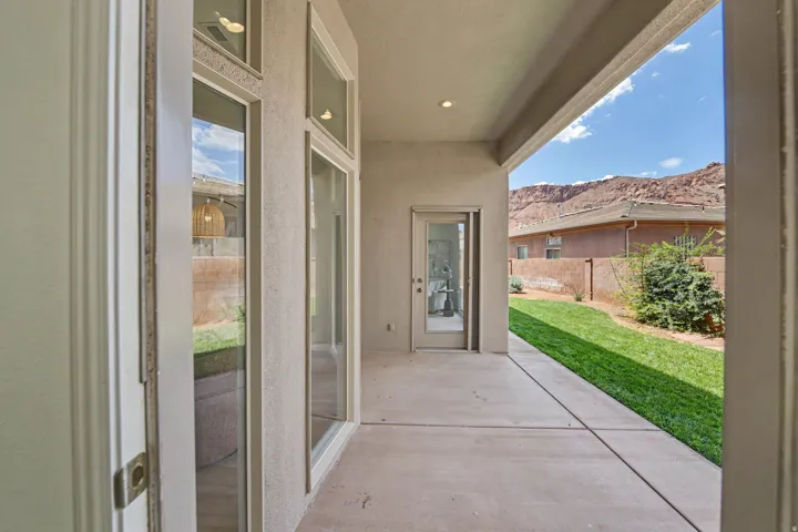 Covered patio with concrete flooring, recessed lighting, and direct backyard access