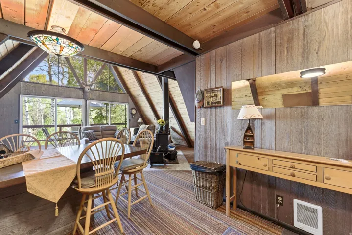 Vaulted wood-paneled ceilings with exposed beams
