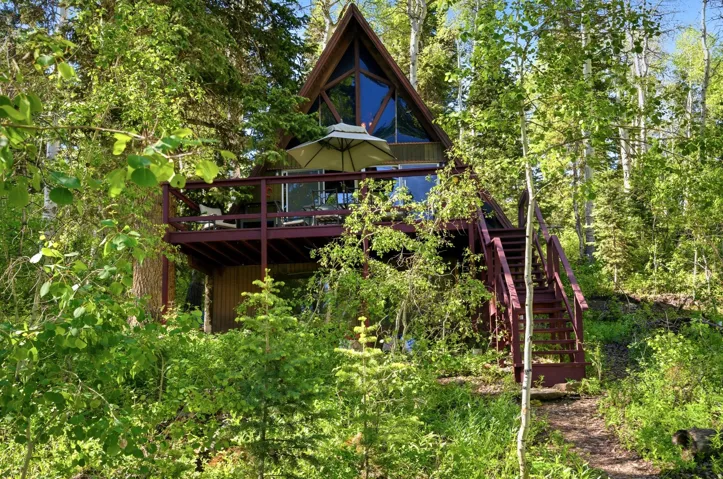A-frame residence nestled among mature trees