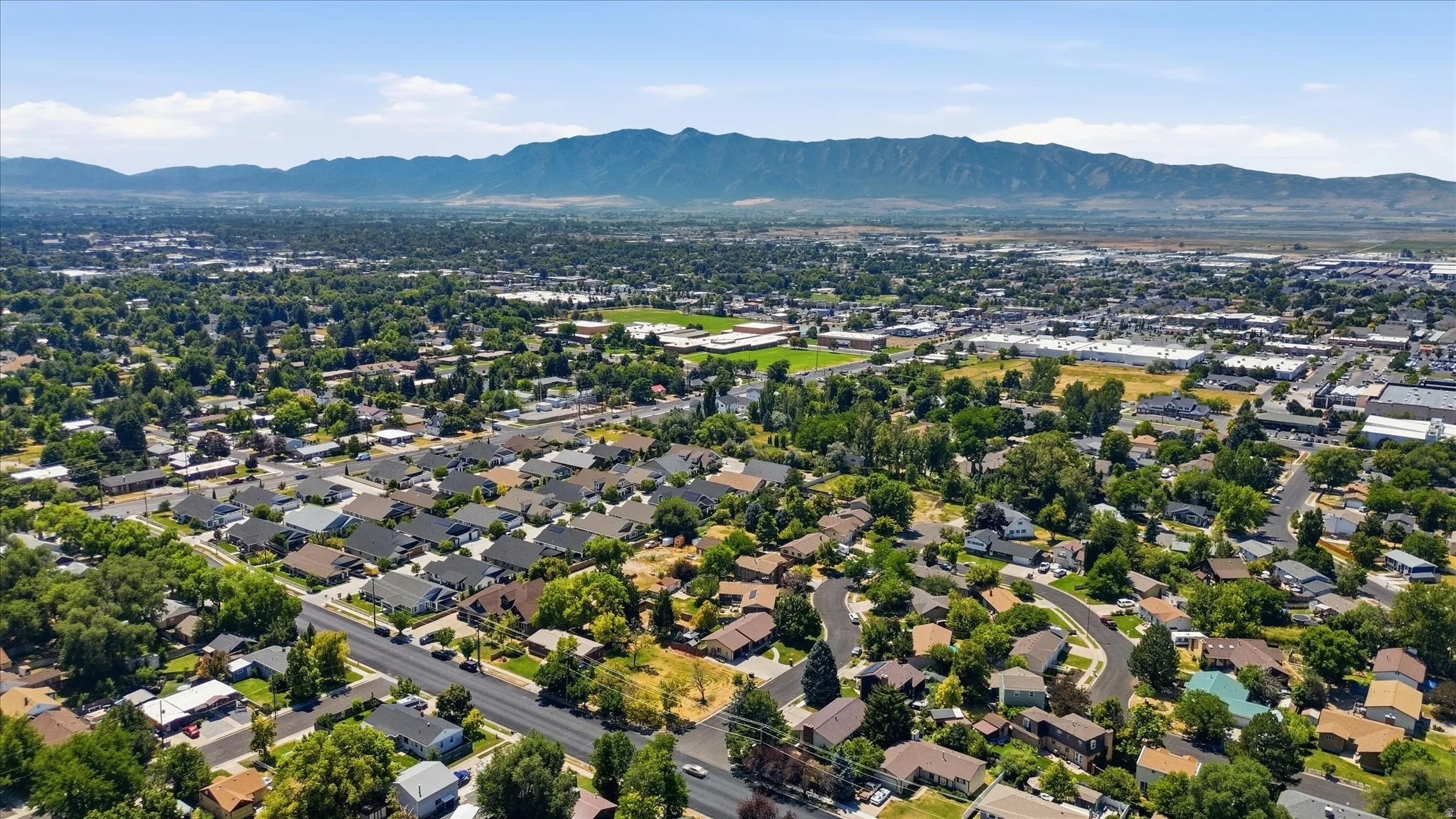 Expansive neighborhood featuring numerous residential properties and mature tree coverage