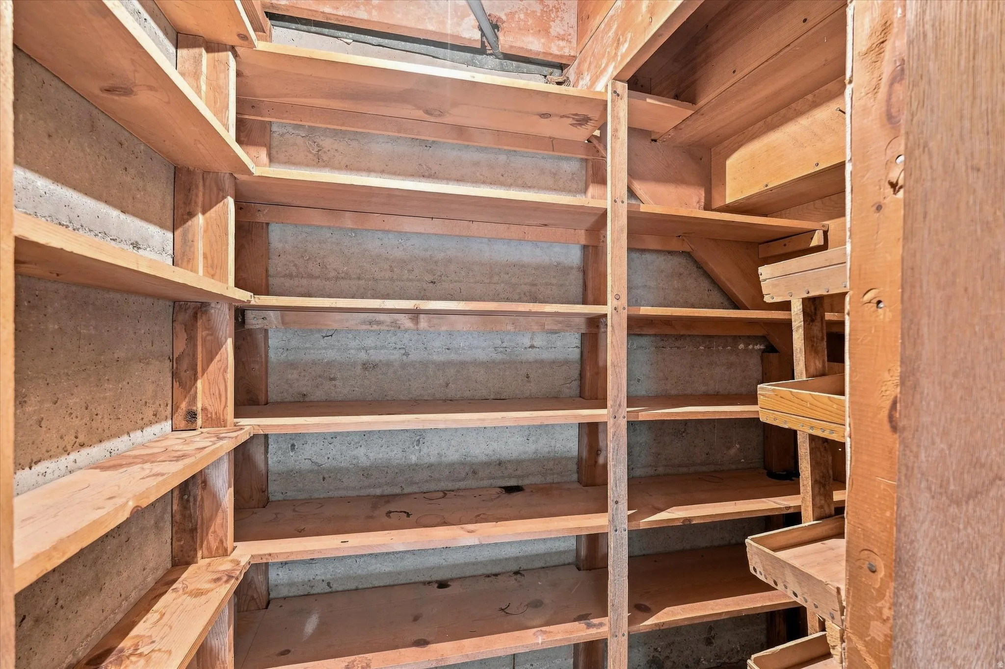 Built-in wood shelving system providing extensive storage capacity
