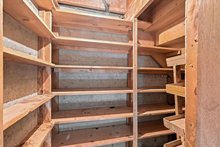 Built-in wood shelving system providing extensive storage capacity