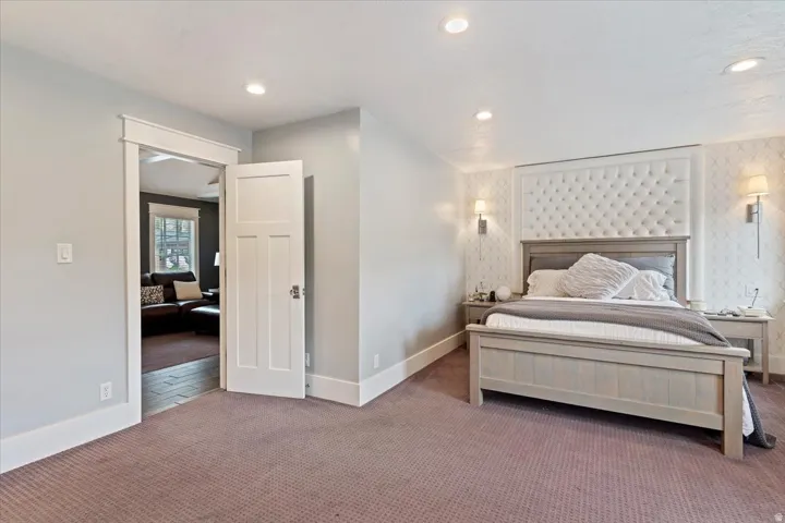 Bedroom featuring patterned carpet and recessed lighting