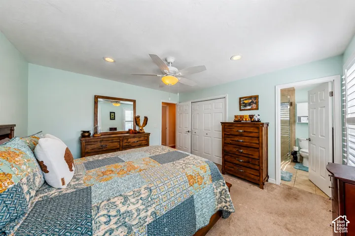 Bedroom featuring a ceiling fan with integrated lighting, recessed lighting, and carpet flooring