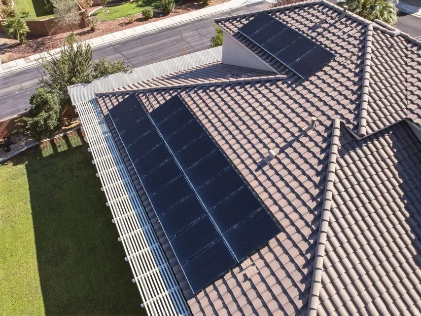 Stunning rooftop solar panel installation featuring multiple high-efficiency photovoltaic modules integrated seamlessly into a clay tile roof system