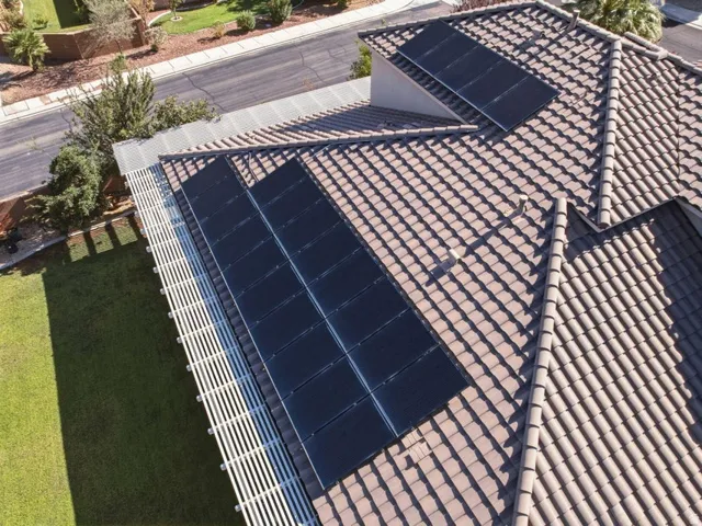 Stunning rooftop solar panel installation featuring multiple high-efficiency photovoltaic modules integrated seamlessly into a clay tile roof system