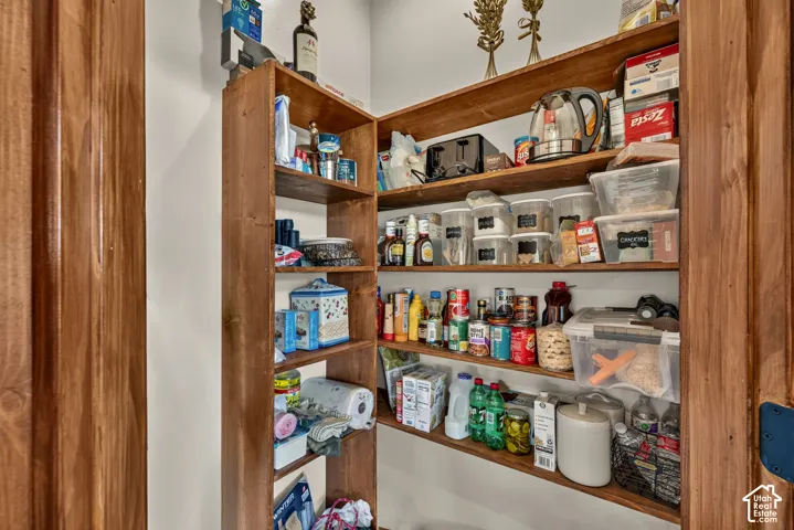 Spacious built-in pantry cabinetry featuring solid wood construction with multiple shelves for organized storage