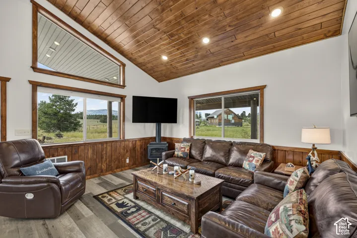 Vaulted wood-paneled ceiling with recessed lighting