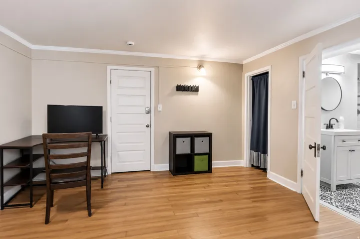 Hardwood-finish flooring throughout, complemented by crisp white trim and neutral wall tones
