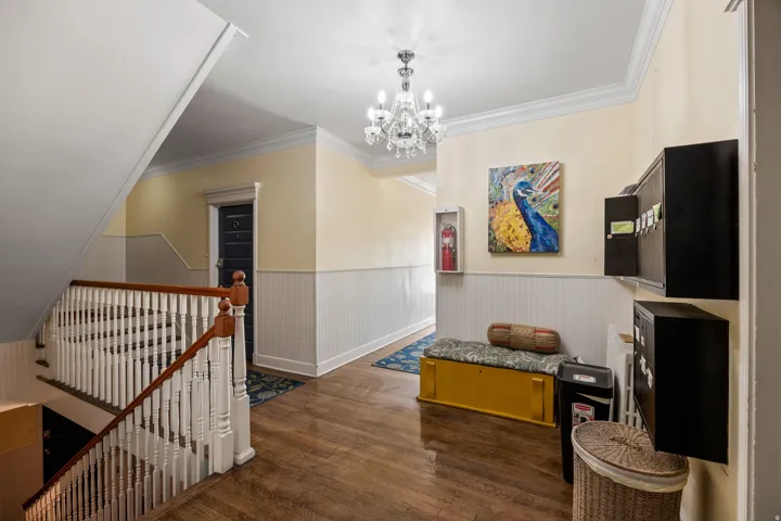Hardwood-finish flooring extending through the entry hall