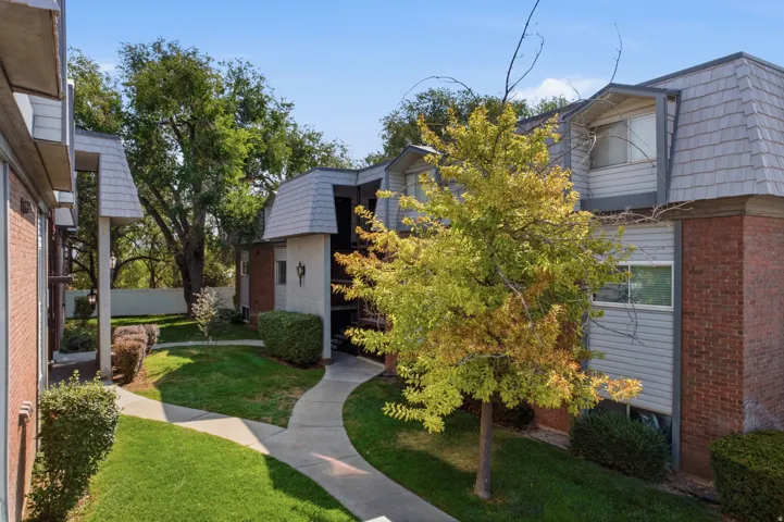 Brick and siding exterior with pitched shingle roofs