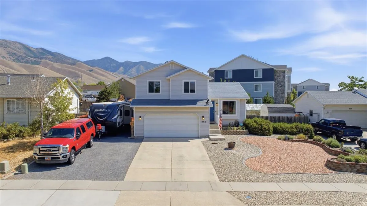 Contemporary two-story residence with light gray siding and white trim