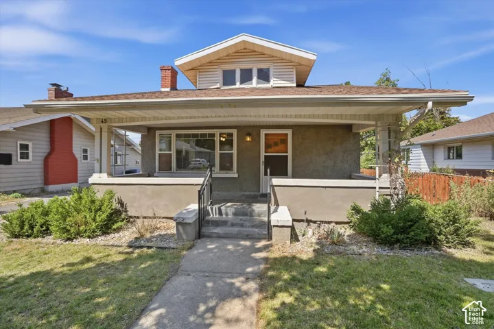 Charming early 20th-century bungalow featuring a welcoming front fa