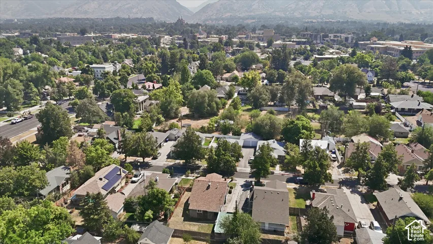 Aerial perspective showcasing a residential area with mature trees and varied architectural styles