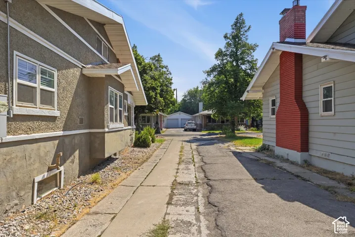 Charming residential street featuring two distinct properties with varied architectural styles