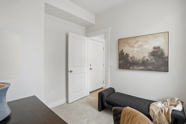 Light-colored carpeting complementing white walls and trim