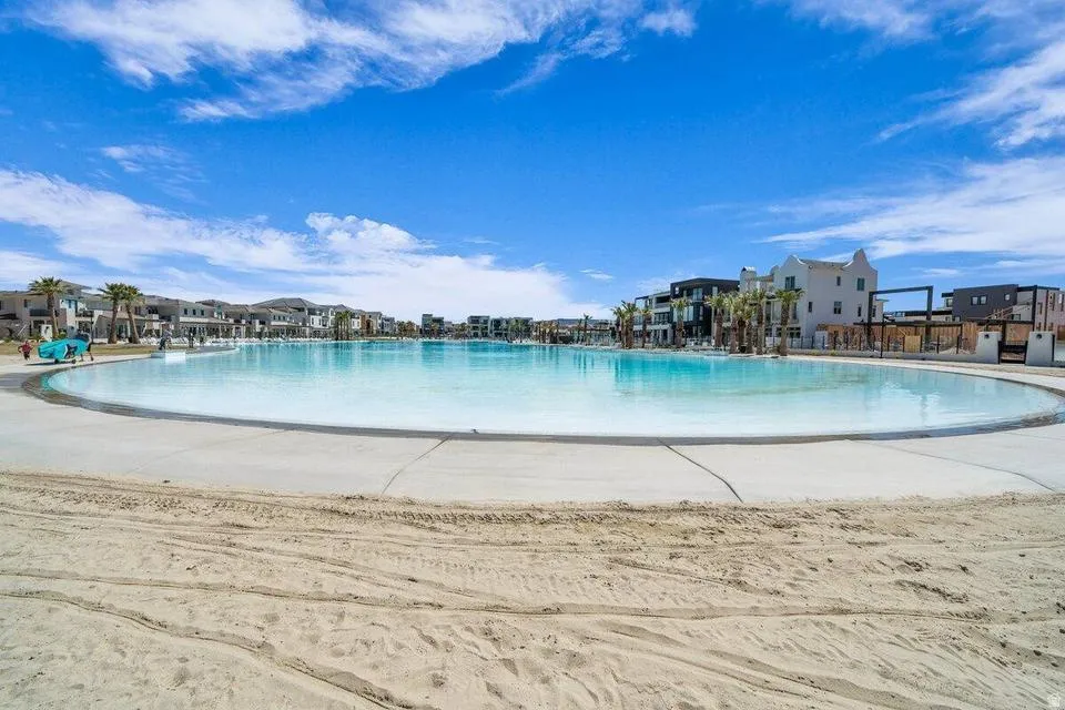 Resort-Style Lagoon Pool with Expansive Sandy Beach Surround