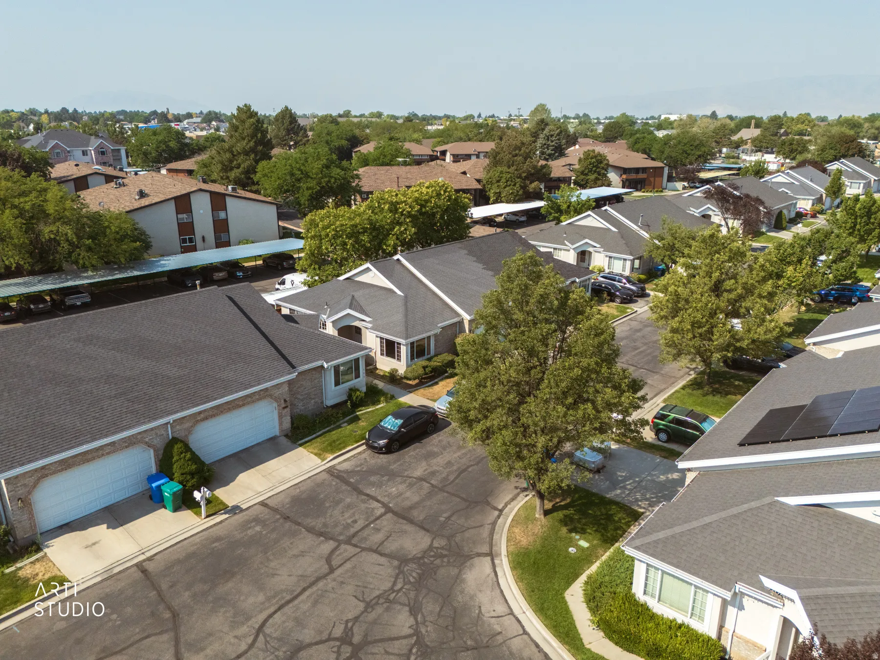 Aerial perspective showcasing a residential community with mature landscaping