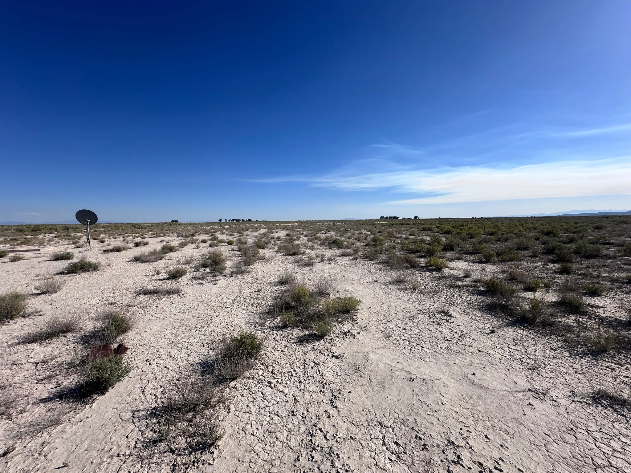 Expansive desert lot featuring native vegetation and sparse shrubland across the property