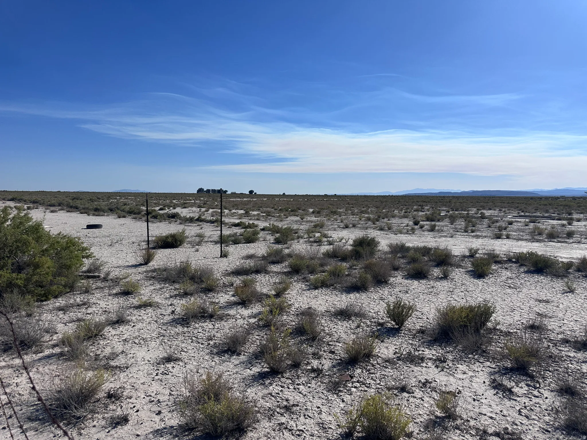 Expansive open land with a clear blue sky overhead