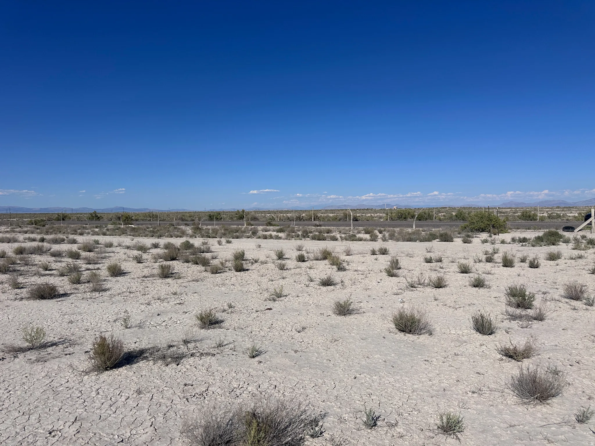 Expansive vacant land featuring natural desert terrain with sparse native vegetation and clear sightlines across the property