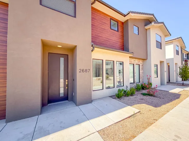 Modern stucco exterior with wood paneling accents