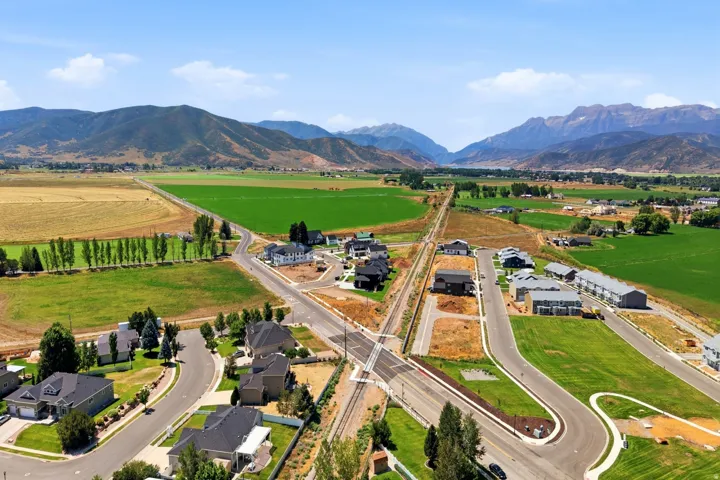 Aerial view showcasing a modern residential development with newly constructed homes situated on manicured lots
