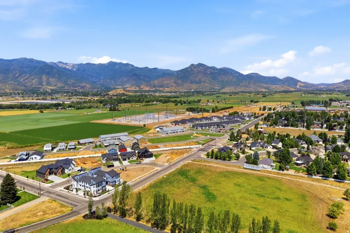Expansive aerial view showcasing this property's prime location within a thriving valley setting