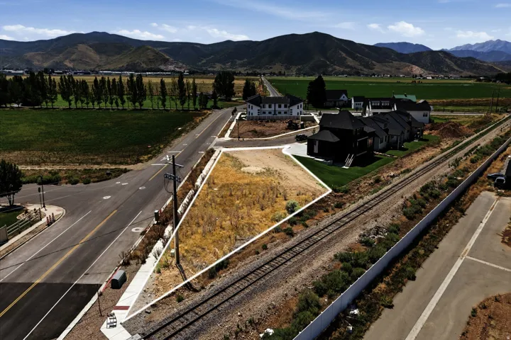 Striking contemporary residence positioned on a substantial corner lot with direct highway and rail access