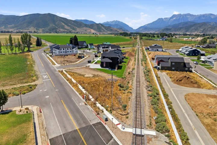 Aerial view of this new construction property showcasing multiple residences on expansive grounds